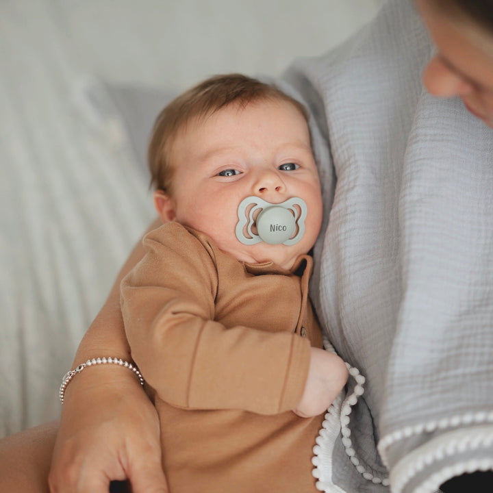 Pistachio Muslin JBØRN Pop Pom Swaddle Organic Muslin Blanket & Teether Set by Just Børn sold by Just Børn