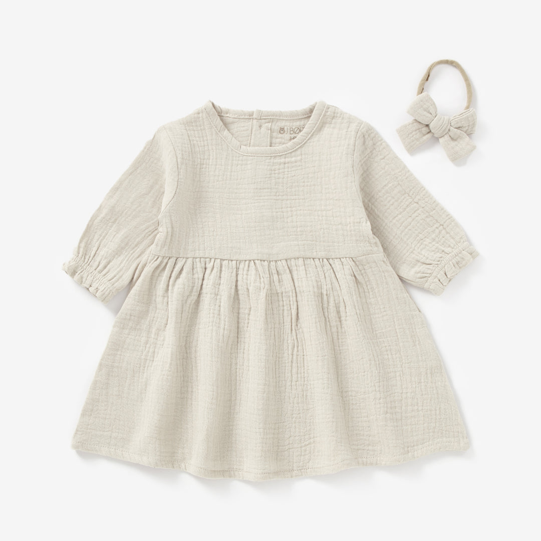 JBØRN Organic Cotton Muslin Baby Girl Dress and Bow Sandstone Muslin - Personalisable Baby Products Sold and Personalised by JustBørn
