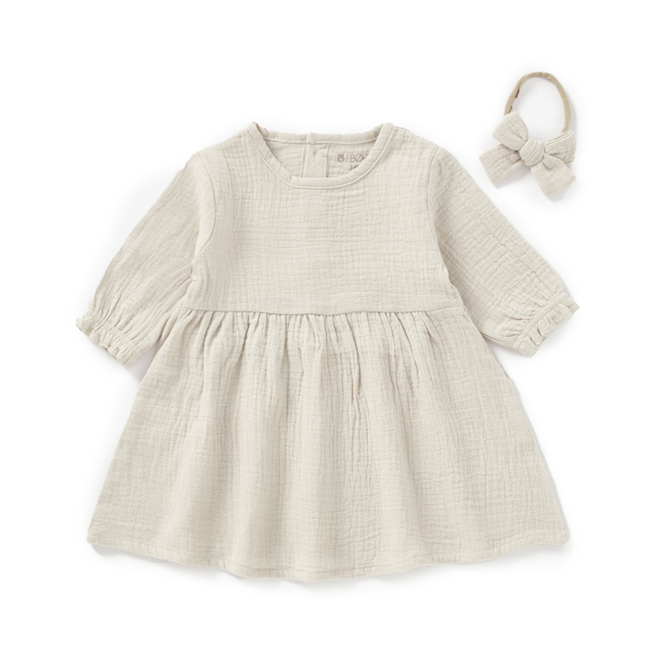 JBØRN Organic Cotton Muslin Baby Girl Dress and Bow Muslin Dress | Sandstone - Personalisable Baby Products Sold and Personalised by JustBørn