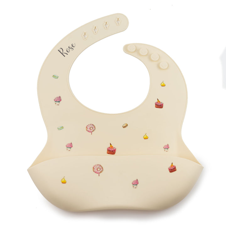 Cakes Ivory JBØRN Silicone Baby Feeding Bib | Personalisable by Just Børn sold by Just Børn