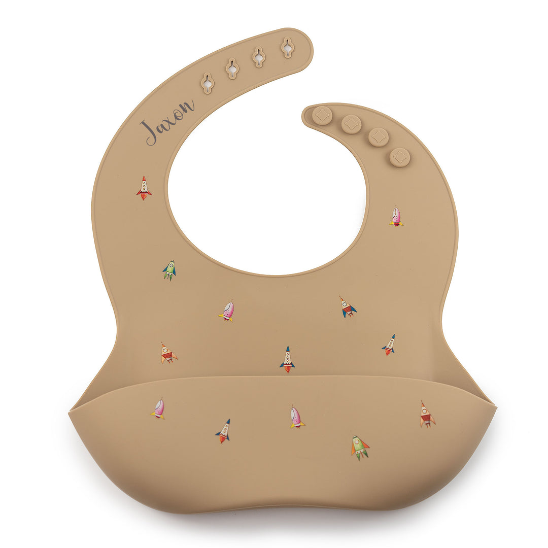 Rockets Taupe JBØRN Silicone Baby Feeding Bib | Personalisable by Just Børn sold by Just Børn